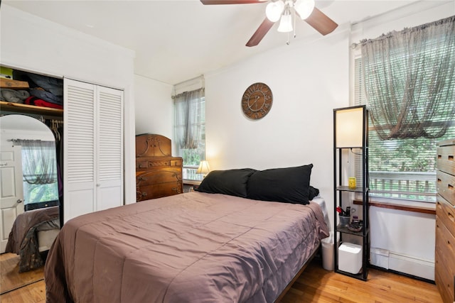 80 Diana Dr, Mastic Beach, NY 11951 - bedroom with light wood finished floors, multiple windows, and a closet
