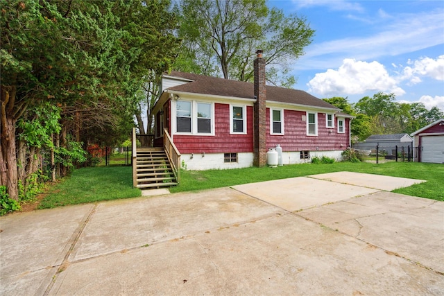 80 Diana Dr, Mastic Beach, NY 11951 - view of front facade featuring a chimney, driveway, stairway, and roof with shingles