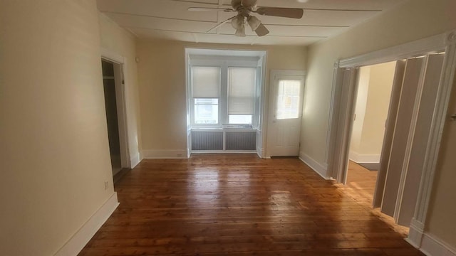 109 Garden St, Poughkeepsie, NY 12601 - unfurnished bedroom with dark wood finished floors, a ceiling fan, and baseboards