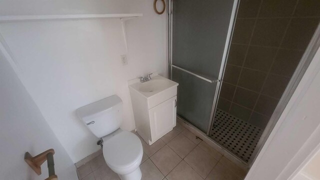 109 Garden St, Poughkeepsie, NY 12601 - full bathroom with a stall shower, vanity, toilet, and tile patterned floors