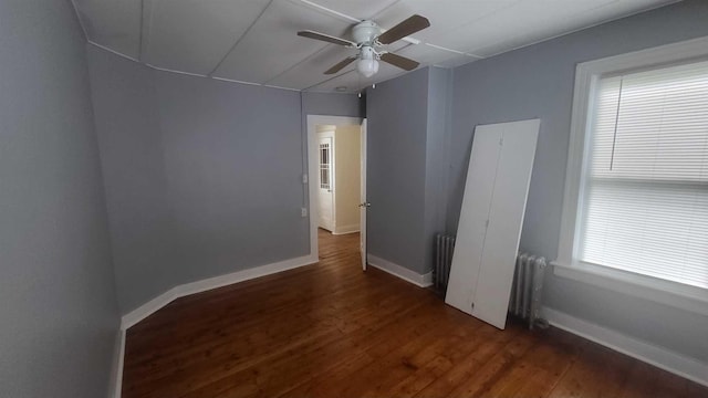 109 Garden St, Poughkeepsie, NY 12601 - spare room with radiator heating unit, ceiling fan, wood finished floors, and baseboards
