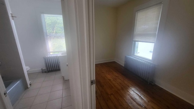 109 Garden St, Poughkeepsie, NY 12601 - unfurnished room featuring radiator, baseboards, and light wood-type flooring