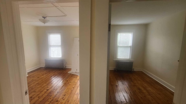 109 Garden St, Poughkeepsie, NY 12601 - spare room with radiator, hardwood / wood-style floors, and healthy amount of natural light