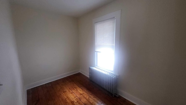 109 Garden St, Poughkeepsie, NY 12601 - spare room featuring radiator, baseboards, and hardwood / wood-style floors