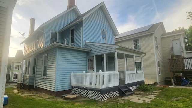 109 Garden St, Poughkeepsie, NY 12601 - rear view of house featuring a chimney and a porch