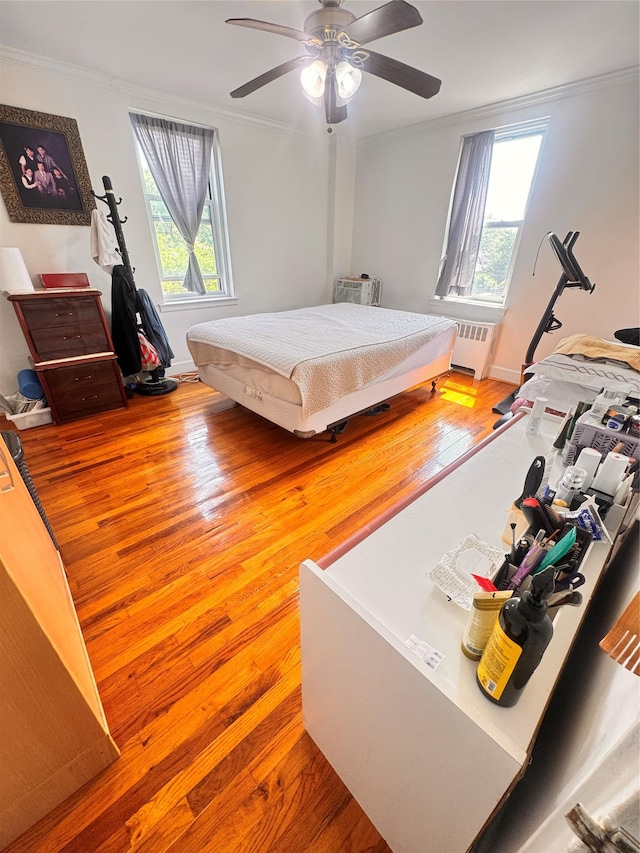30-11 Parsons Blvd Unit 3P, Flushing, NY 11354 - bedroom with ornamental molding, radiator, multiple windows, wood finished floors, and baseboards