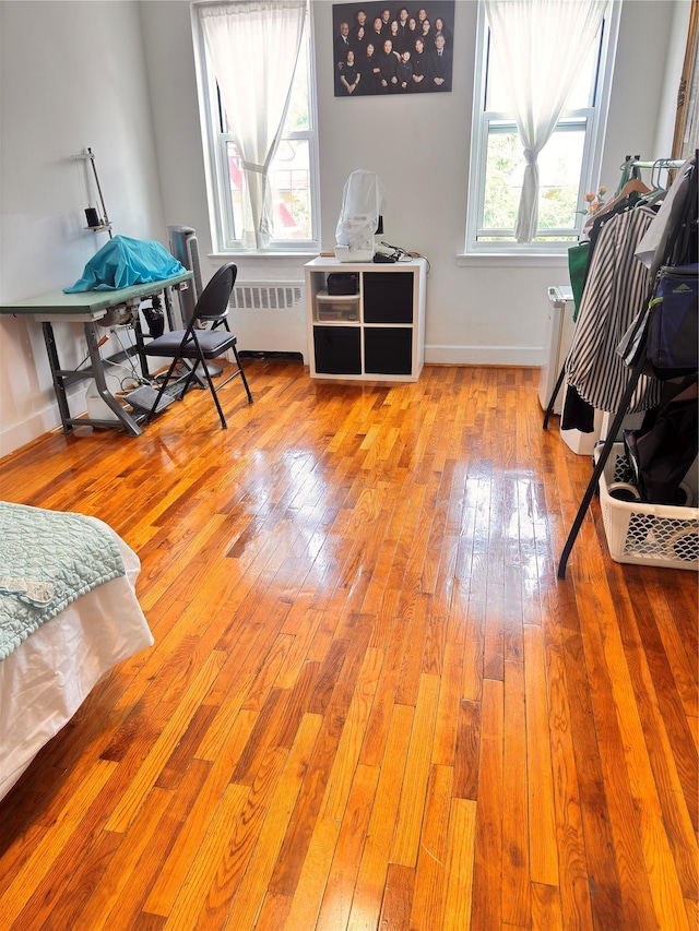 30-11 Parsons Blvd Unit 3P, Flushing, NY 11354 - home office with radiator, wood-type flooring, and baseboards