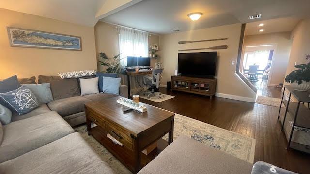 2568 Seminole Ave, Seaford, NY 11783 - living area with wood finished floors and baseboards