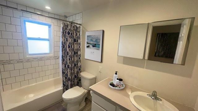 2568 Seminole Ave, Seaford, NY 11783 - full bathroom featuring vanity and shower / bathtub combination with curtain