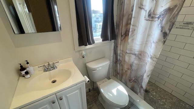 2568 Seminole Ave, Seaford, NY 11783 - bathroom featuring vanity and tiled shower