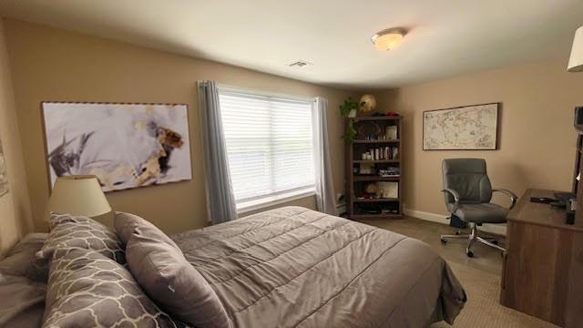 2568 Seminole Ave, Seaford, NY 11783 - carpeted bedroom with baseboards