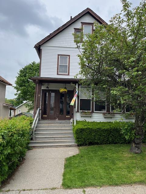 39 Harrison St, Middletown, NY 10940 - view of front facade with a front lawn and a porch