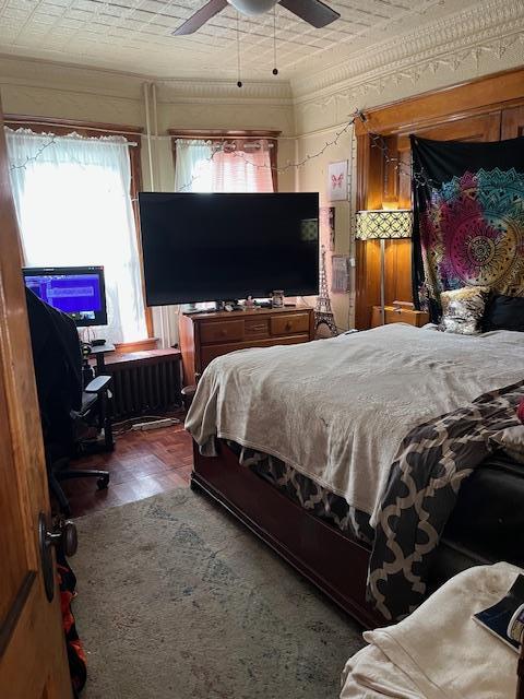 39 Harrison St, Middletown, NY 10940 - bedroom with radiator heating unit, a ceiling fan, and ornamental molding