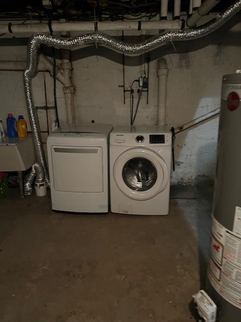 39 Harrison St, Middletown, NY 10940 - laundry area featuring water heater and separate washer and dryer