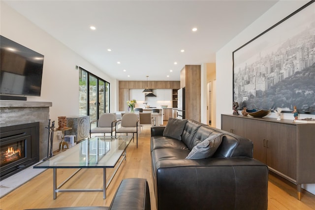 290 Mountain Rd, Pleasantville, NY 10570 - living room with light wood-type flooring, a glass covered fireplace, and recessed lighting