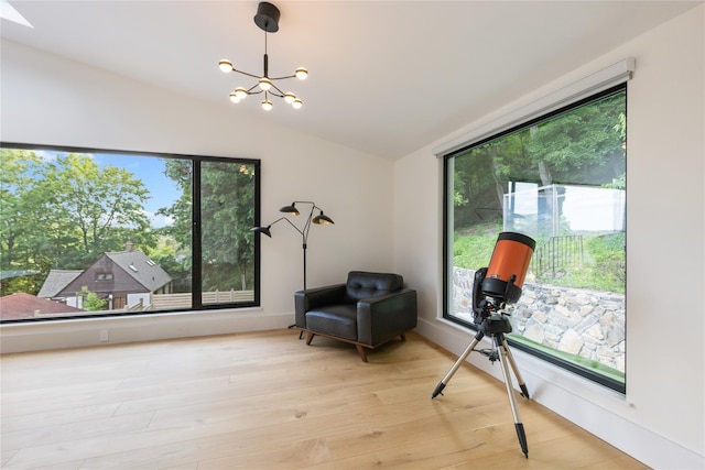 290 Mountain Rd, Pleasantville, NY 10570 - living area featuring lofted ceiling, plenty of natural light, a chandelier, and light wood-style floors