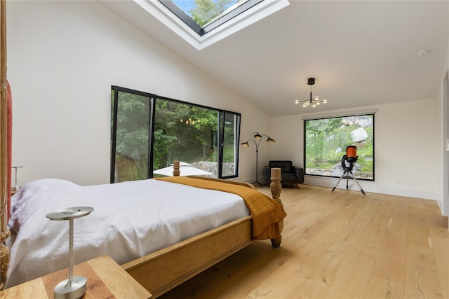 290 Mountain Rd, Pleasantville, NY 10570 - bedroom with a skylight, light wood finished floors, high vaulted ceiling, and a chandelier