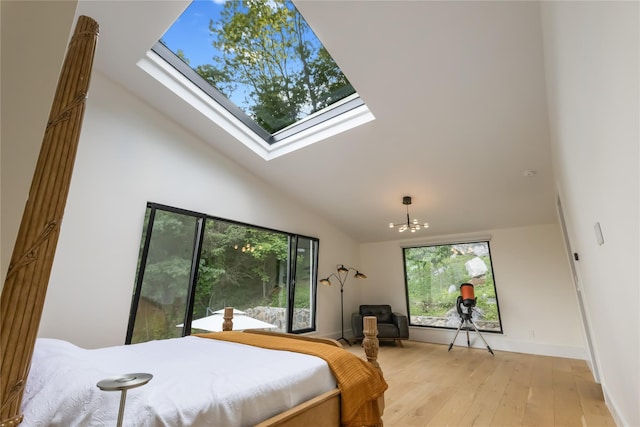 290 Mountain Rd, Pleasantville, NY 10570 - bedroom featuring high vaulted ceiling, a skylight, light wood-style flooring, and a chandelier