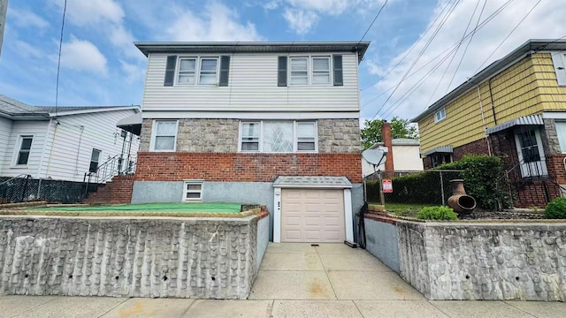 136-23 61st Rd, Flushing, NY 11367 - view of front of home with driveway, an attached garage, and brick siding