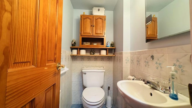 136-23 61st Rd, Flushing, NY 11367 - bathroom featuring toilet, wainscoting, a sink, and tile walls