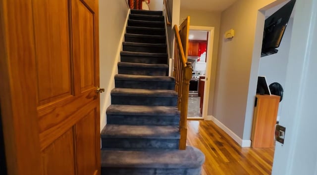 136-23 61st Rd, Flushing, NY 11367 - stairs with wood finished floors and baseboards