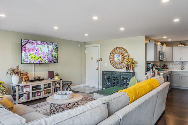 9-05 166th St Unit 4A, Beechhurst, NY 11357 - living room featuring recessed lighting, baseboards, and dark wood-style flooring