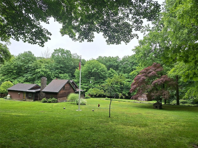 1002 Kitchawan Rd, Ossining, NY 10562 - view of green lawn featuring a forest view