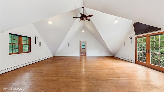 1002 Kitchawan Rd, Ossining, NY 10562 - additional living space featuring a baseboard heating unit, ceiling fan, lofted ceiling, wood finished floors, and french doors