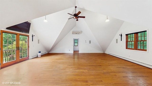 1002 Kitchawan Rd, Ossining, NY 10562 - bonus room with a wall unit AC, a ceiling fan, vaulted ceiling, light wood-style floors, and a baseboard heating unit
