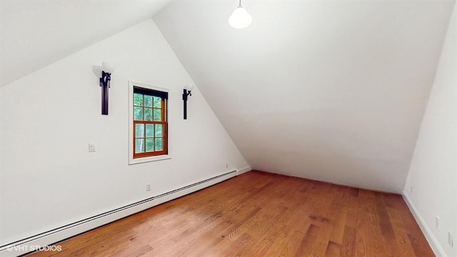 1002 Kitchawan Rd, Ossining, NY 10562 - additional living space featuring a baseboard heating unit, wood finished floors, and lofted ceiling