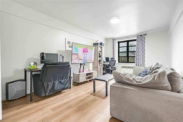 26-20 141st St Unit 4A, Flushing, NY 11354 - home office featuring radiator and wood finished floors