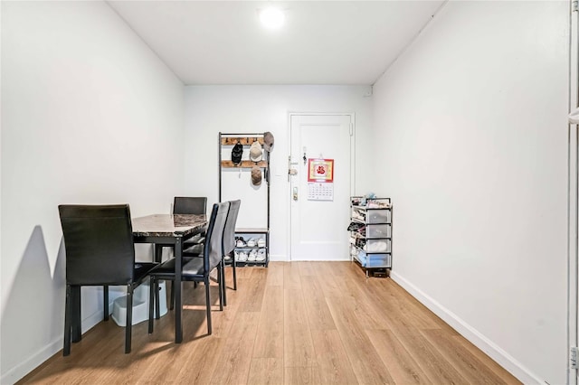 26-20 141st St Unit 4A, Flushing, NY 11354 - dining area with light wood-style flooring and baseboards