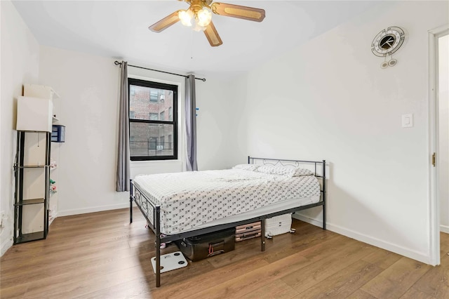 26-20 141st St Unit 4A, Flushing, NY 11354 - bedroom with baseboards and wood finished floors