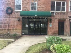 28-02 Parsons Blvd Unit 6H, Flushing, NY 11354 - view of exterior entry with brick siding