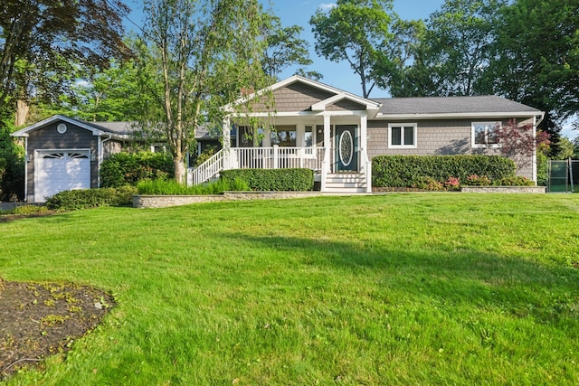 109 Dogwood Ln, Port Jefferson, NY 11777 - view of front of house with a porch, a front lawn, and a garage