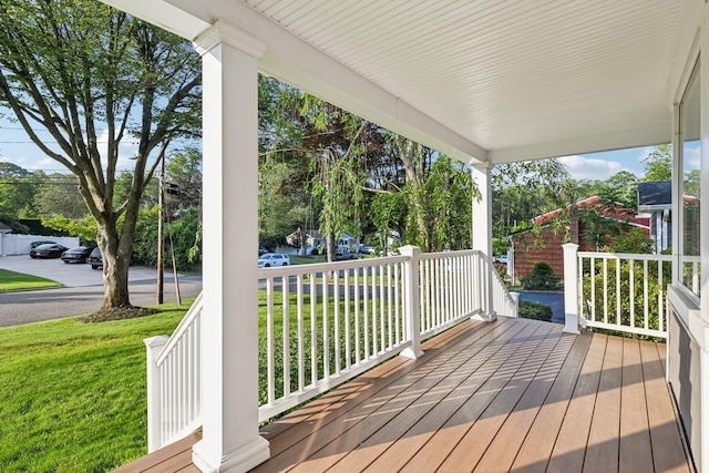 109 Dogwood Ln, Port Jefferson, NY 11777 - wooden porch with a lawn