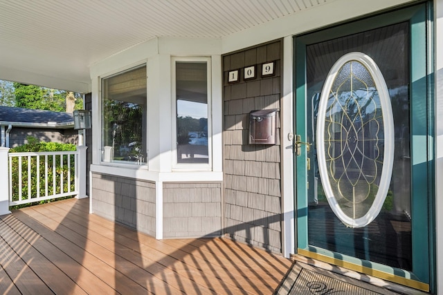 109 Dogwood Ln, Port Jefferson, NY 11777 - property entrance with a porch