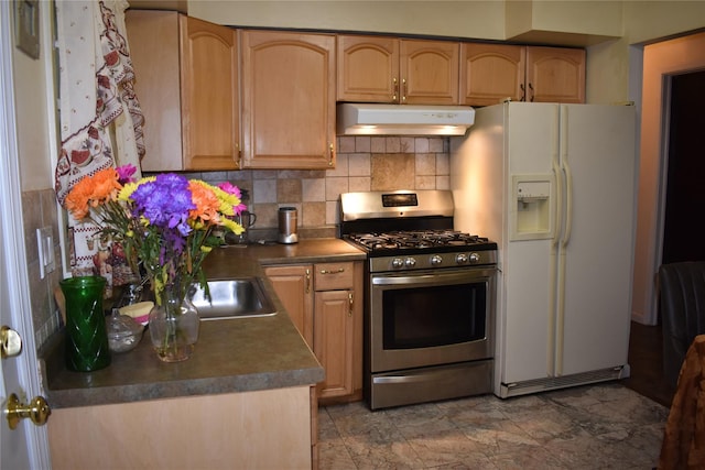 13 W Hickory St, Spring Valley, NY 10977 - kitchen featuring gas range, under cabinet range hood, white refrigerator with ice dispenser, tasteful backsplash, and dark countertops
