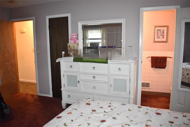 13 W Hickory St, Spring Valley, NY 10977 - bedroom with tile walls, carpet, a wainscoted wall, and ensuite bath