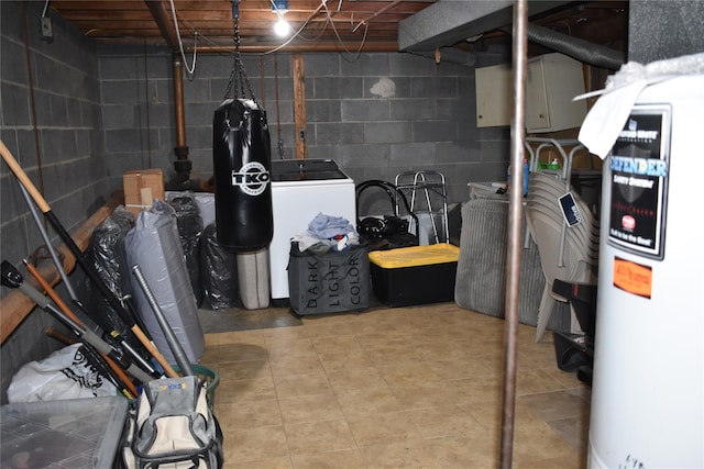 13 W Hickory St, Spring Valley, NY 10977 - unfinished basement with water heater, washer / clothes dryer, and concrete block wall