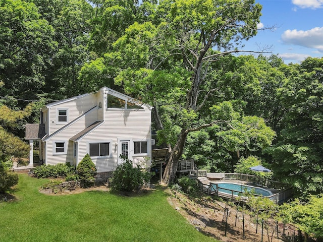 3841 Indian Hill Rd, Shrub Oak, NY 10588 - back of property with a lawn, a wooden deck, and a forest view