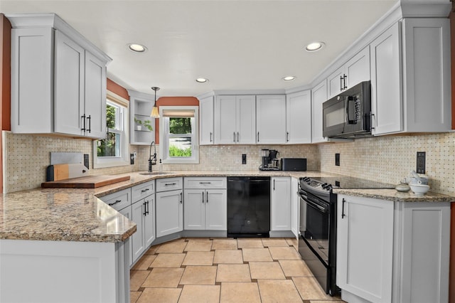 3841 Indian Hill Rd, Shrub Oak, NY 10588 - kitchen with black appliances, recessed lighting, decorative backsplash, and light stone countertops