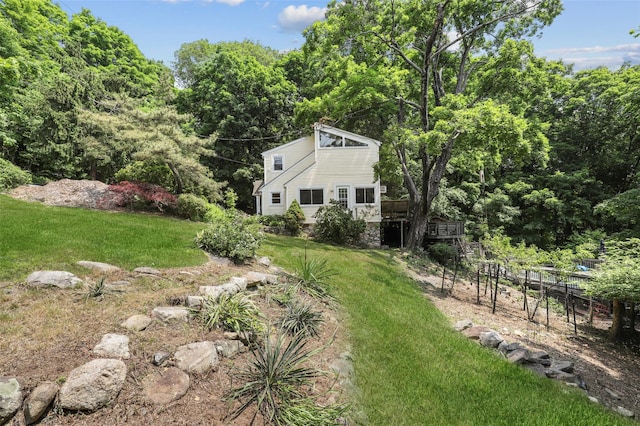 3841 Indian Hill Rd, Shrub Oak, NY 10588 - view of green lawn featuring a wooden deck and a view of trees