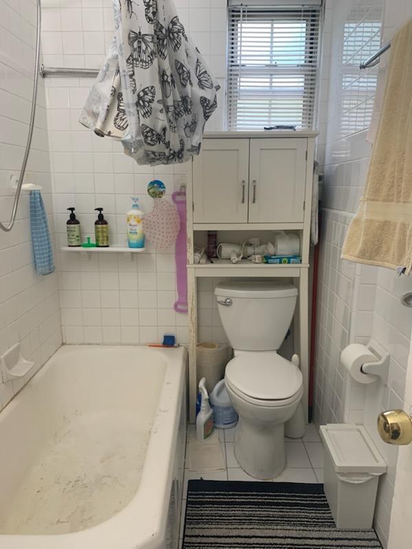 13539 78th Ave Unit 23B, Flushing, NY 11367 - full bathroom featuring a bath, tile patterned flooring, toilet, tile walls, and a shower