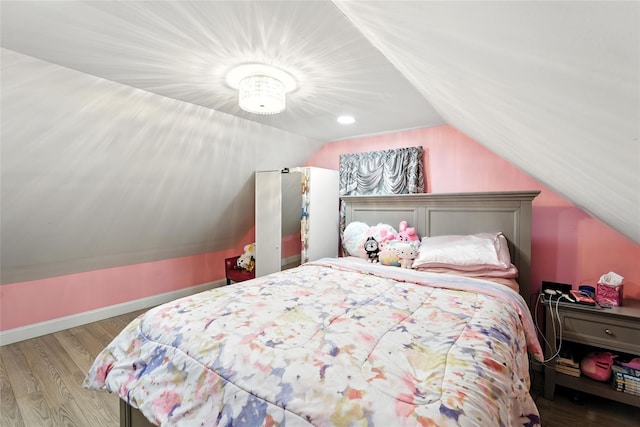 26 Fieldmere St, Elmont, NY 11003 - bedroom featuring vaulted ceiling and wood finished floors