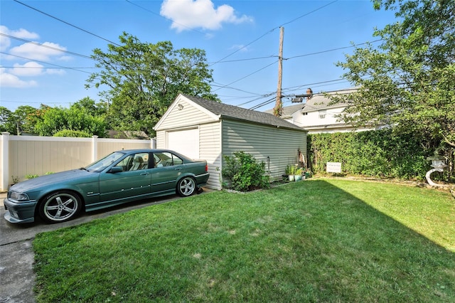 26 Fieldmere St, Elmont, NY 11003 - view of yard featuring a detached garage, an outbuilding, and driveway