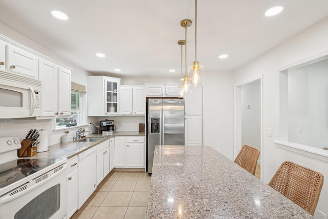 52 Iroquois Trl, Ridge, NY 11961 - kitchen with white appliances, a sink, white cabinets, glass insert cabinets, and recessed lighting