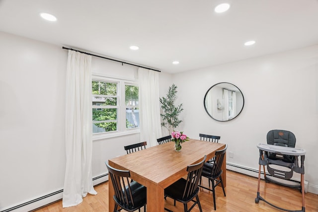 52 Iroquois Trl, Ridge, NY 11961 - dining room featuring a baseboard heating unit, light wood-style floors, and recessed lighting
