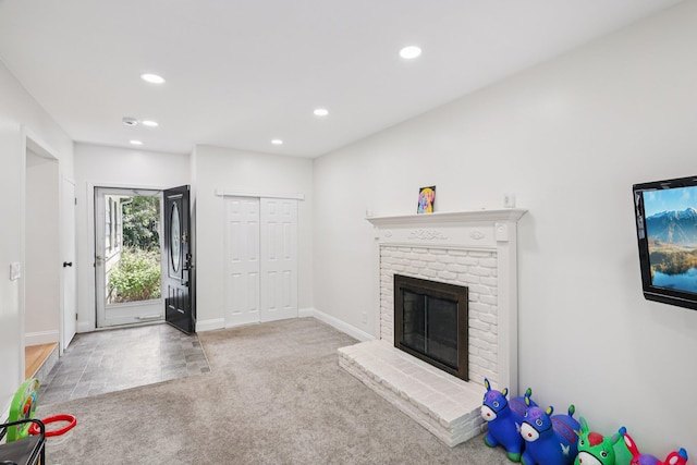 52 Iroquois Trl, Ridge, NY 11961 - unfurnished living room with carpet floors, recessed lighting, a fireplace, and baseboards