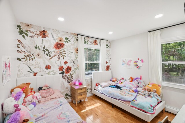 52 Iroquois Trl, Ridge, NY 11961 - bedroom with multiple windows, light wood-type flooring, recessed lighting, and baseboards
